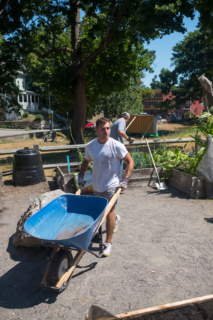 A STAG employee volunteers for CitySprouts to build garden classrooms in the Roxbury area